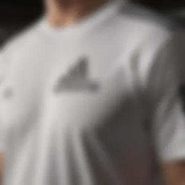 Adidas logo prominently displayed on the white tee shirt, symbolizing brand identity