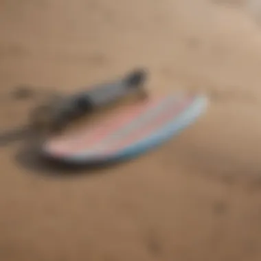 Close-up of high-quality skimboarding equipment laid out on the sand