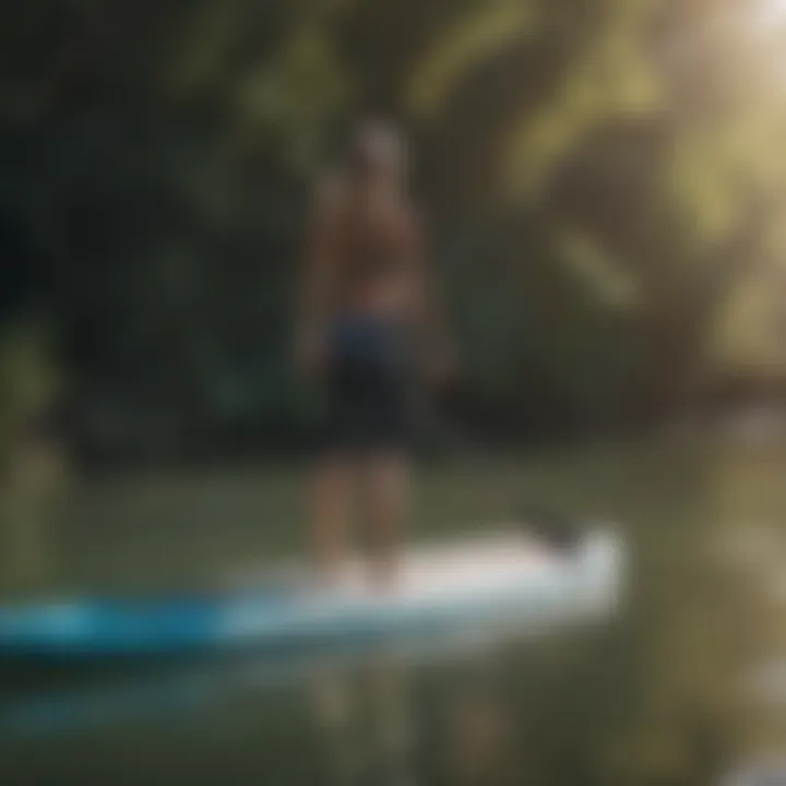 User preparing to paddleboard with the Billabong inflatable paddle board