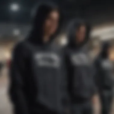 Group of skaters wearing black skate hoodies at a skate park