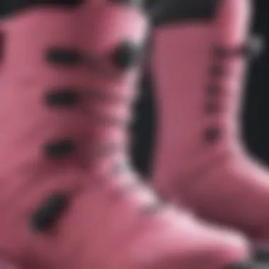 Close-up of pink snowboard boots showcasing design details