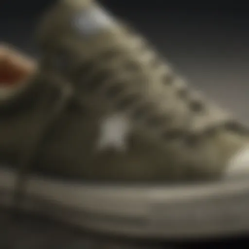 A close-up view of Army Green Converse Low Tops showcasing their design and texture.