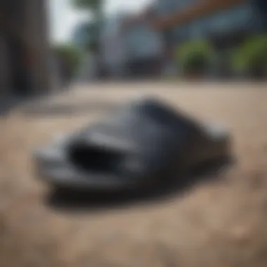 Versatile Use of Black Nike Slides in Outdoor Settings Black Nike slides in an outdoor setting, highlighting their versatility for extreme sports.
