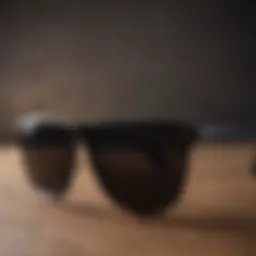 Stylish black Ray-Ban sunglasses on a wooden table