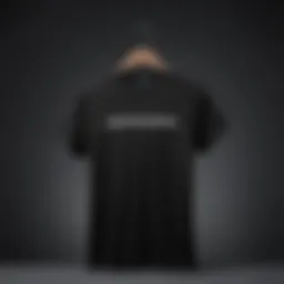 A classic black t-shirt displayed against a minimalist backdrop, showcasing its timeless appeal.