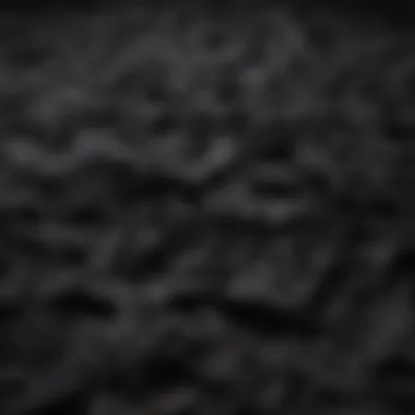 An array of black t-shirts made from various materials, highlighting fabric diversity.