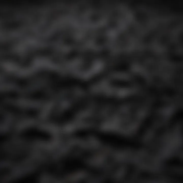 An array of black t-shirts made from various materials, highlighting fabric diversity.