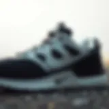 Close-up view of black and white Nike workout shoe showcasing intricate design details
