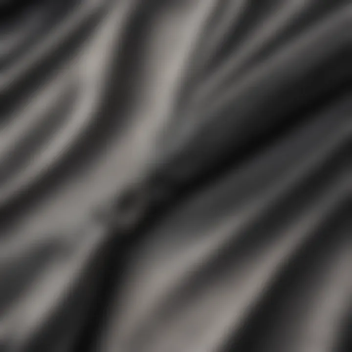 A close-up of premium fabric texture used in a cropped zip-up hoodie