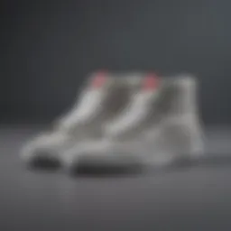 Stylish light gray Vans high tops placed on a textured surface