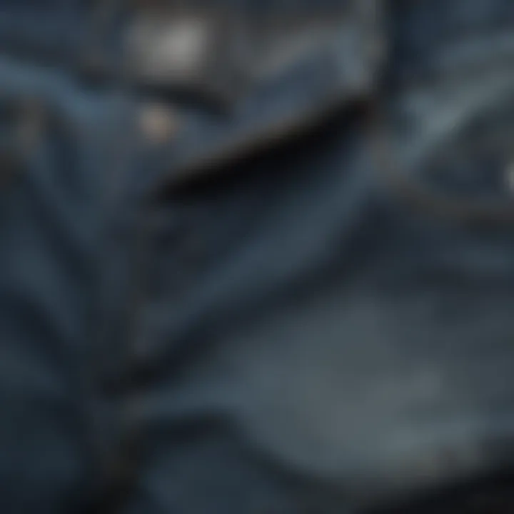 Close-up of fabric textures used in long baggy denim shorts.