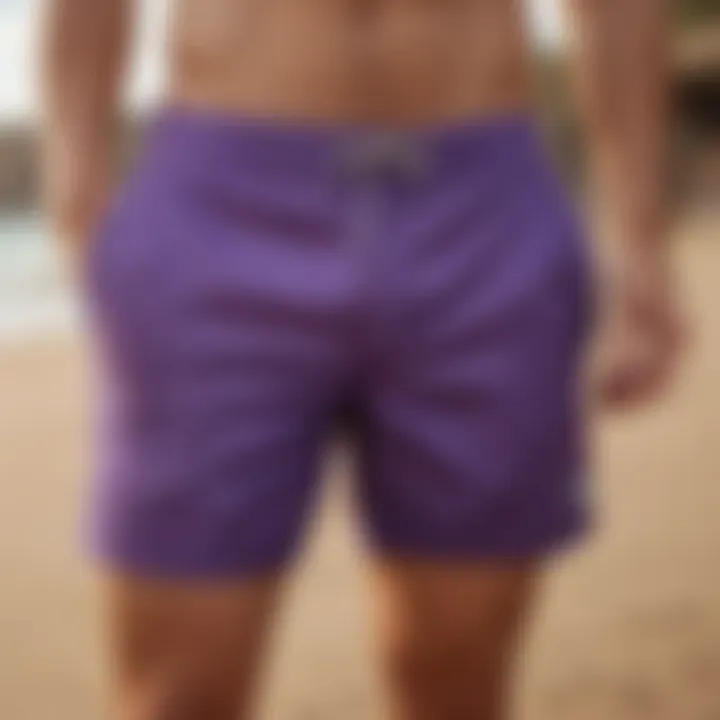 Stylish purple board shorts on a sandy beach