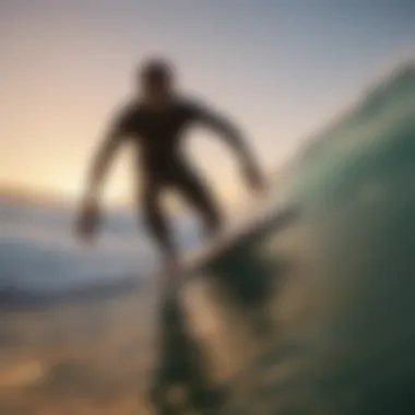 Surfer riding a wave on a shortboard during sunset