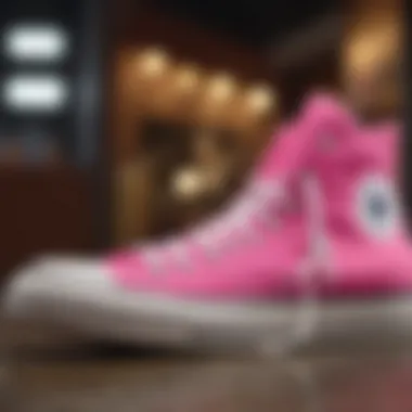 A stylish pair of pink Chuck Taylors showcasing their vibrant color and unique design.