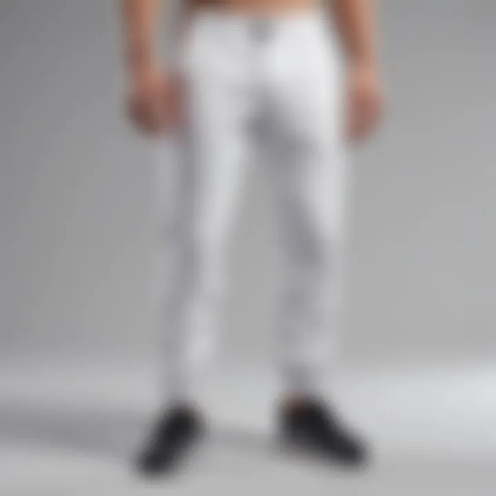 Collection of white running pants in various styles and cuts displayed on a neutral background.