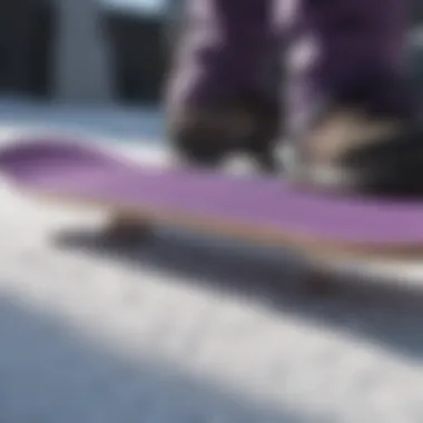 Snowboard equipped with premium purple grip tape on its surface.