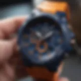 A close-up view of G Shock watch showcasing blue and orange color scheme