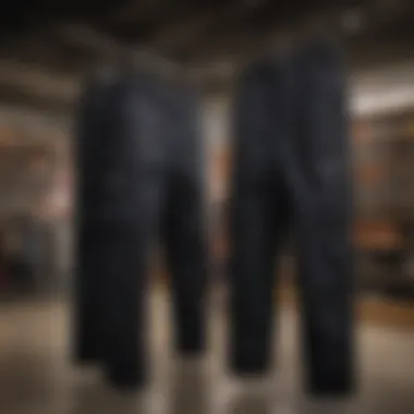 A collection of black baggy Dickies displayed in a modern retail environment