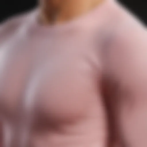 A close-up of a light pink long sleeve t-shirt designed for extreme sports, showcasing its breathable fabric.