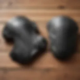 A selection of budget mountain bike knee pads displayed on a wooden surface