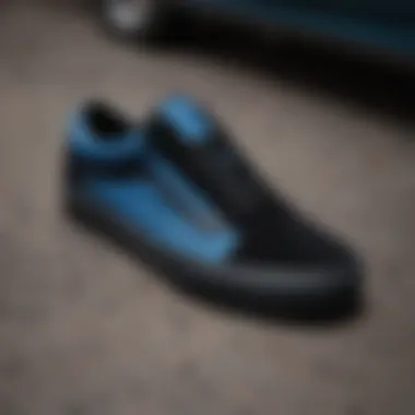 Material Details of the Black and Blue Vans Old Skool Close-up of the black and blue Vans Old Skool showcasing the unique canvas and suede materials.