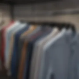 A collection of various simple shirts displayed on hangers, showcasing different styles and colors.