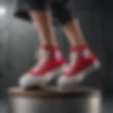 An athlete performing a stunt while wearing Chuck Taylor All Star Lift Platform sneakers.