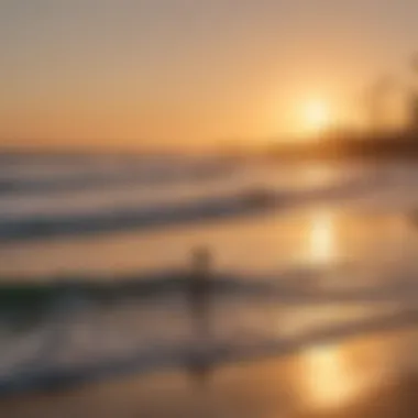 Sunset over Huntington Beach with surfers in the distance