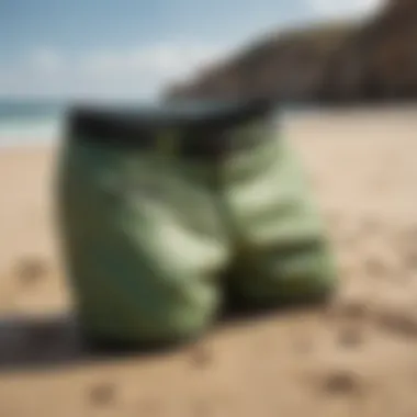 Jet ski shorts displayed on a sandy beach, highlighting their stylish design.