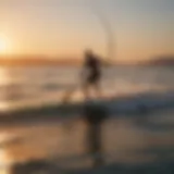A kite paddle surfer gliding across the water at sunset