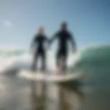 Surf instructor guiding a student on a wave