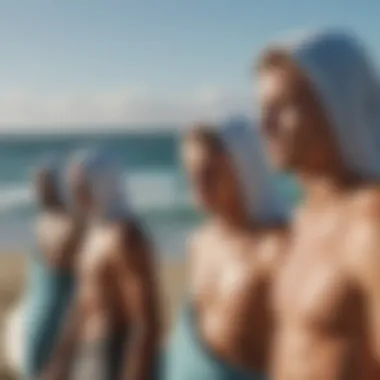 A group of surfers wearing Rip Curl hooded towels post-session