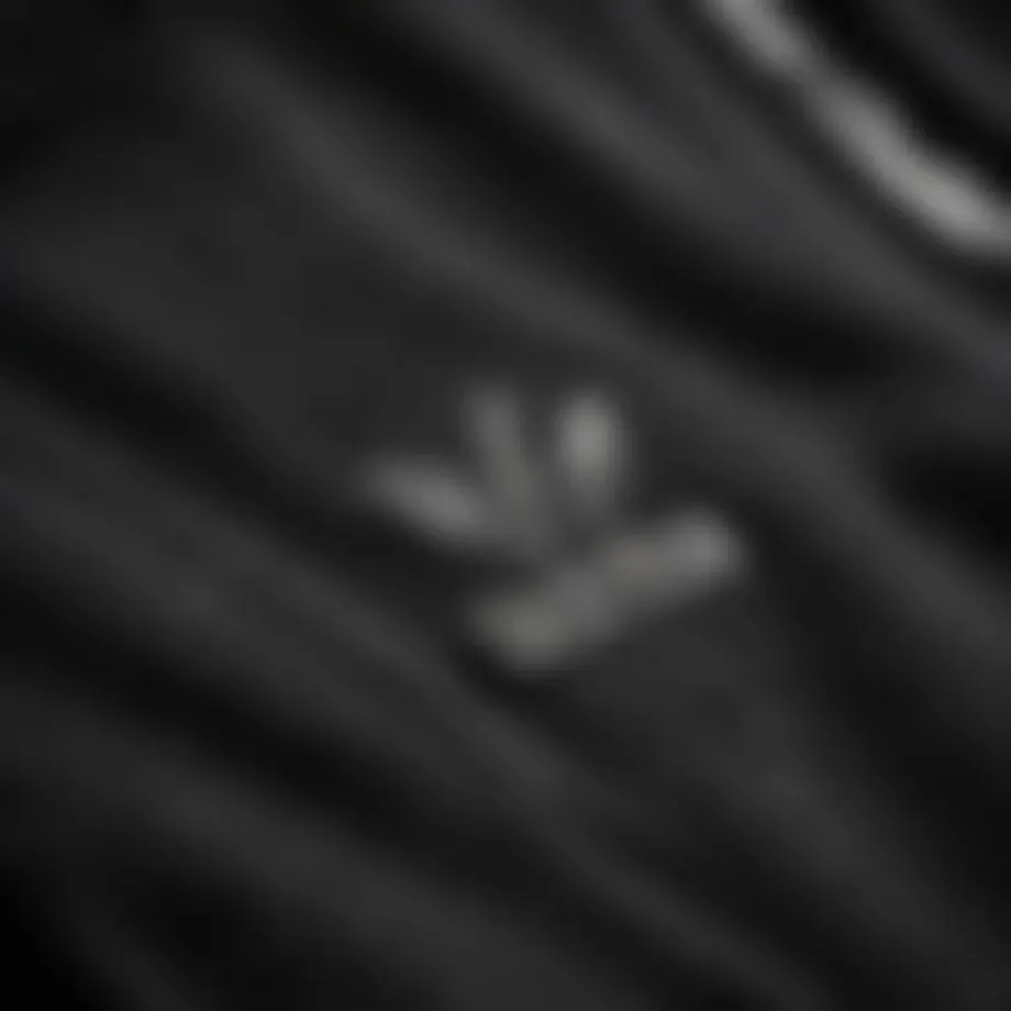 Close-up of the fabric texture of the adidas black crew neck sweatshirt