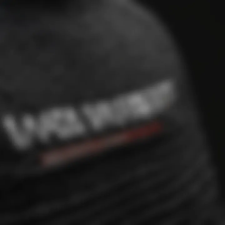 Close-up of the design elements of a black Vans sweater.