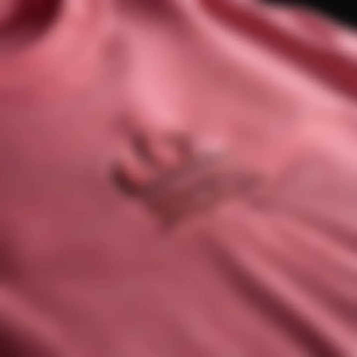 Close-up of the fabric and stitching of the hot pink Adidas sweatshirt.