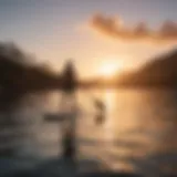 A serene sunset view of a paddleboarder gliding across calm waters