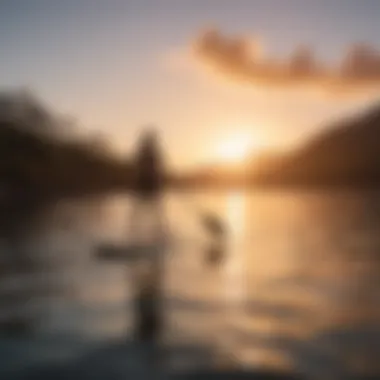 A serene sunset view of a paddleboarder gliding across calm waters