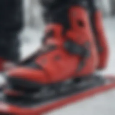 Close-up of red snowboard bindings highlighting performance features.