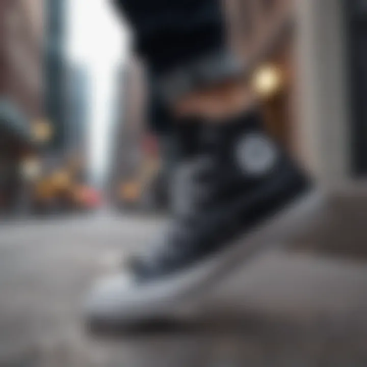 Stylish black high top Chucks against an urban backdrop