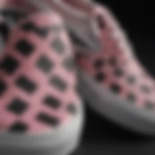 Close-up of the textured surface of pink and black checkerboard Vans shoes