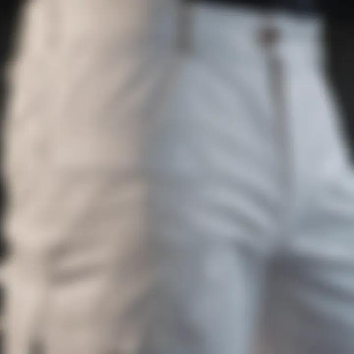 Close-up of the fabric and design features of white BDU pants.