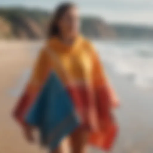 A vibrant surfing poncho displayed on a sandy beach, showcasing its design and material.