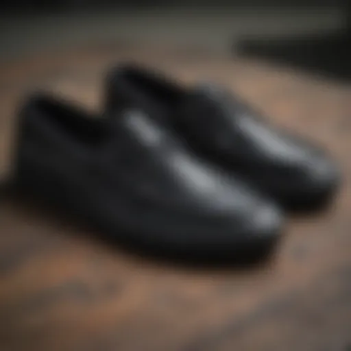 Close-up of Vans black boat shoes showcasing their unique design features.