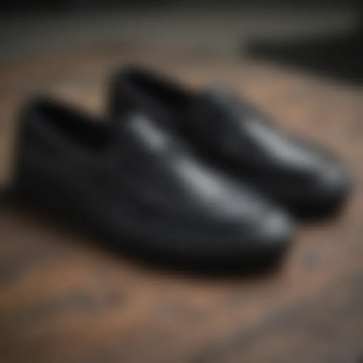Close-up of Vans black boat shoes showcasing their unique design features.