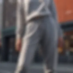 Stylish grey sweatpants paired with a chic top in a modern urban setting